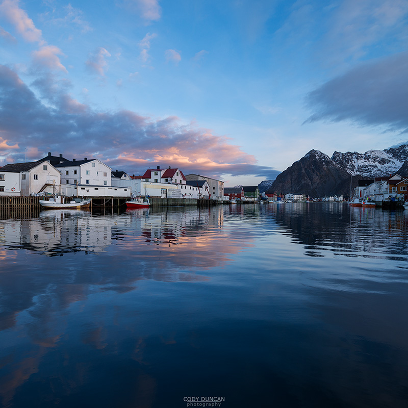 Mountain reflection in Harbour at scenic fishing village of Henningsvær, Austvågøy, Lofoten Islands, Norway