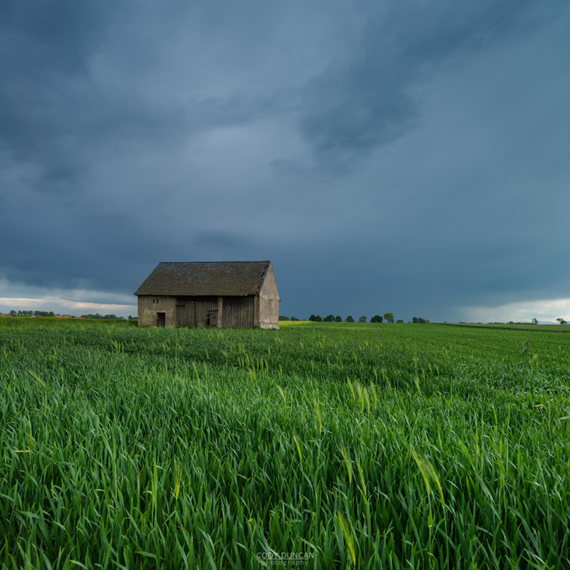 Old barn in farm field, Prudnik County, Opole Voivodship, Silesia, Poland