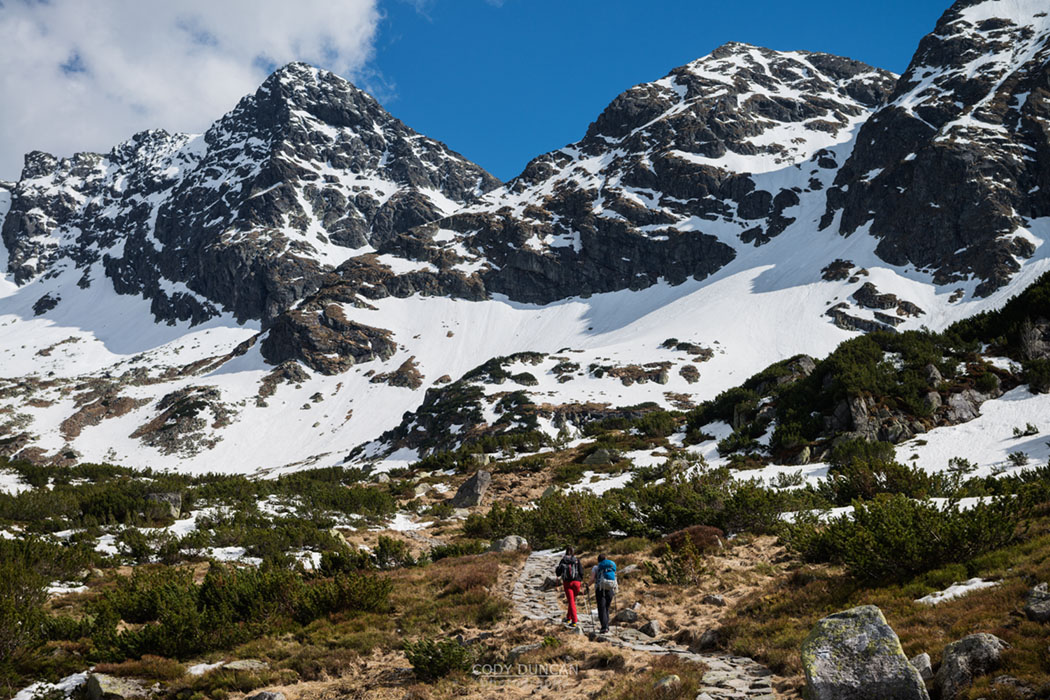 Two female hikers hiking in Tatra mountains, Poland